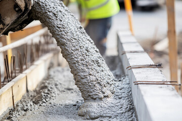 Poster - Wet concrete pouring at construction site in progress Generative AI