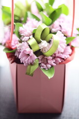 Poster - A beautiful arrangement of pink flowers in a pink gift box, perfect for any occasion.