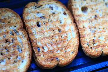 Poster - Close-up view of four slices of bread on a tray.