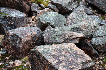 Poster - A natural rocky formation covered in green moss, ideal for outdoor and nature-themed designs.