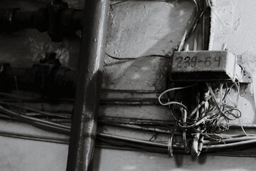 Aufkleber - A collection of electrical wires photographed in black and white.