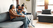 © peopleimages.com - Hug, love and smile with family on sofa for bonding, care and embrace together. Support, happiness and connection with parents and child in living room of home for commitment, relax or growth