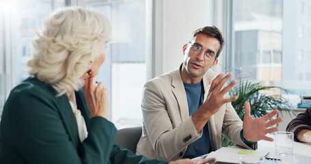 Poster - Discussion, group and man with ideas, meeting and planning for marketing strategy, serious and boardroom. Communication, media buyer and people in office for campaign, teamwork or project in business