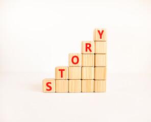 Fototapete - Story symbol. Concept word Story on beautiful wooden blocks. Beautiful white table white background. Business lifestyle story concept. Copy space.