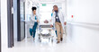 © CC/peopleimages.com - Running, hospital and doctors with bed for emergency, surgery and help for medical service. Healthcare, er and people rush with stretcher for accident, operation or surgical treatment in hallway