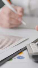 Poster - A skilled professional reviews financial documents, making insightful notes and showcasing a detailed accounting process that requires precision and comprehensive analysis for effective management