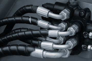 Aufkleber - Bundle of pipes connected to industrial hydraulic pneumatic machine, industrial concept background