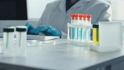 Aufkleber - A dedicated scientist in protective gear prepares vaccine samples for analysis in a sterile environment, underscoring the importance of modern research in enhancing public health and safety