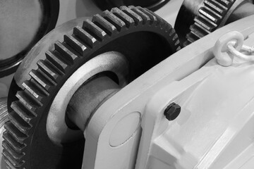 Aufkleber - A large gear is shown with a chain hanging from it. The chain is attached to a large gear, and the two gears are connected by a bolt. Concept of mechanical power and strengt