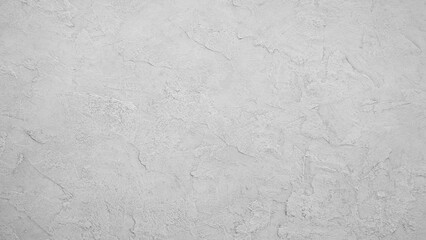 Aufkleber - A white wall with a grey texture. The wall is smooth and has a somewhat rough texture. The wall is a blank canvas, ready to be painted or decorated