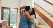 © peopleimages.com - Hug, couple and excited in new home for real estate, investment and freedom or financial security. Happy man, woman and celebration in embrace for moving house, property ownership or mortgage loan