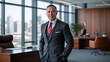 © Alexandre - Confident executive stands in modern office with city views, wearing a suit and tie, radiating success and professional attire.
