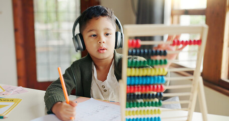 Leinwandbilder - Home, maths and child with headphones, learning and listening to podcast for education and abacus. Studying, student and kid with audio for homework, growth and development with knowledge or numbers