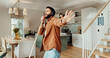 © peopleimages.com - Headphones, sing and sweeping with man in home for chores, responsibility or spring cleaning. Broom, dance and music with happy person in apartment for housekeeping, listening or radio streaming