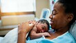 © Digital Bamboo - Loving African American Mother Holding Newborn Baby Skin-to-Skin in Hospital Room