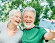 © Lumos sp - woman man outdoor senior couple happy lifestyle retirement together love elderly video call selfie photo mobile smartphone communication phone sport active fitness outfit training healthy