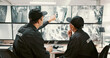 © DavidL25/peopleimages.com - Camera, security and people pointing on computer screen for surveillance, observation and monitoring. Inspection, footage and guards with live feed for protection and building safety in control room