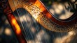 © Sampao - Top-down view of a concert harp's soundboard, strings, and detailed wooden craftsmanship.