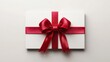 © peppastocker - Elegant white gift box with red satin ribbon bow on clean background