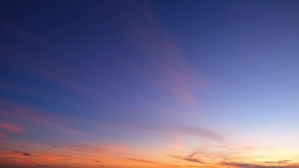 Wall Mural - 4K Timelapse capturing the fiery glow of the sunset sky, transitioning into a romantic tapestry of colorful clouds. Time lapse. Horizon background.
