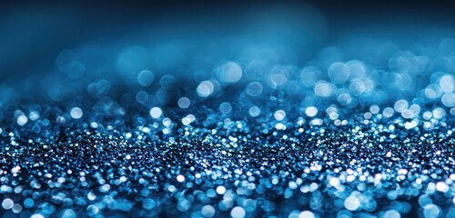 Wall Mural - glittering blue background with a soft, out-of-focus effect, adding depth and elegance to any design