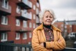 © Vorda Berge - Portrait of a senior body positive woman with slightly messy modern apartment in the background in Sweden