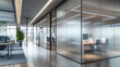 © meher - A contemporary office space featuring frosted glass walls and partitioned meeting rooms, offering a sleek and professional atmosphere.