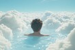 © Julia - A calm infinity pool, providing a sweeping vista of the vast ocean under a bright blue sky with soft, fluffy clouds