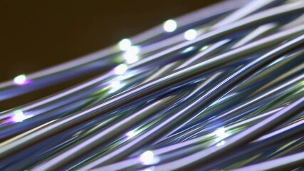 Poster - Dynamic movement of shimmering metallic wires in abstract artistic light