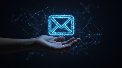 A hand holds a glowing email icon amidst a network of data connections.