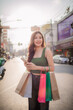 © Pang - Asian woman shopping taking selfie while enjoying shopping in city street