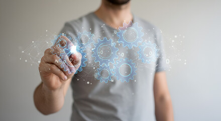 Poster - Man Interacting with Holographic Gears System with Engineering and Technology Concept in Gray Background