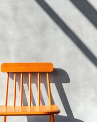Poster - Minimalist Design Meets Bold Color Vibrant Orange Windsor Chair Casting Dramatic Shadow on Concrete - Contemporary Scandinavian Interior Styling Trends