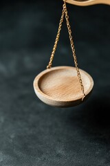 Poster - Minimalist Work-Life Balance Scale Elegant Brass Chain Suspended Wooden Bowl Symbolizing Precision, Mindfulness, and Contemporary Professional Equilibrium