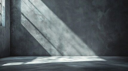 Poster - Light streaming through window onto gray concrete wall and floor creating a stark contrast scene