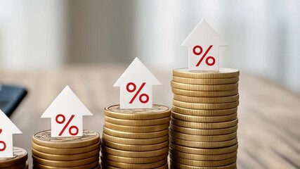 Poster - Stacks of coins with percentage arrows and calculator on a wooden surface in sunlight