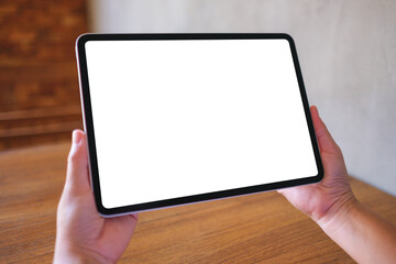 Wall Mural - mockup image of a woman holding digital tablet with blank desktop screen