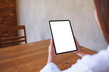 Wall Mural - mockup image of a woman holding digital tablet with blank desktop screen