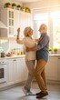 © DND - Senior couple dancing in the kitchen, enjoying retirement and a loving relationship. (Marriage)