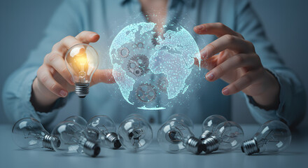 Aufkleber - Person Holding Lit Lightbulb with Digital Globe and Multiple Lightbulbs on White Table in Soft Light