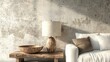 © Faizal - Serene interior scene showcasing a wooden table lamp and bowl near a comfortable white sofa with a textured wall background