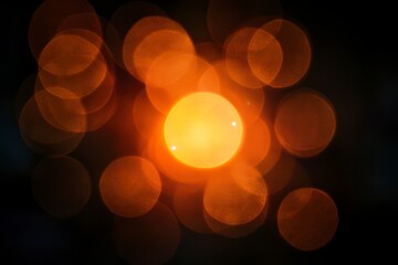 Wall Mural - Abstract Glowing Light Circles with Orange Bokeh Effect on Dark Background