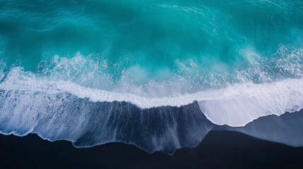Poster - A beach where the sand is pitch black against bright turquoise waves.