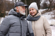 © New Africa - Lovely senior couple walking at winter park