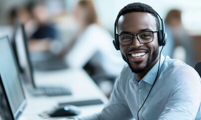 Poster - An African American call center agent smiles warmly as he works in a modern office.