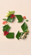© Georgy - Natural recycling symbol made of leaves and flowers, design banner
