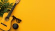 © Bounpaseuth - Yellow Acoustic Guitar Sunglasses and Speaker Summer Flatlay