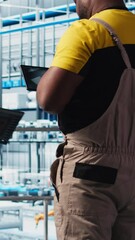 Poster - vertical video photovoltaic smart factory engineer uses tablet to design production lines for assemb