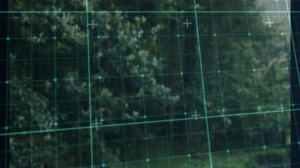 Poster - Grid overlay animating on blurred greenery background in outdoor setting