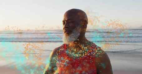 Poster - By ocean, man in red tank top smiling with colorful animation particles